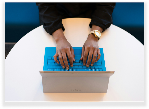 Aerial view of person typing on laptop